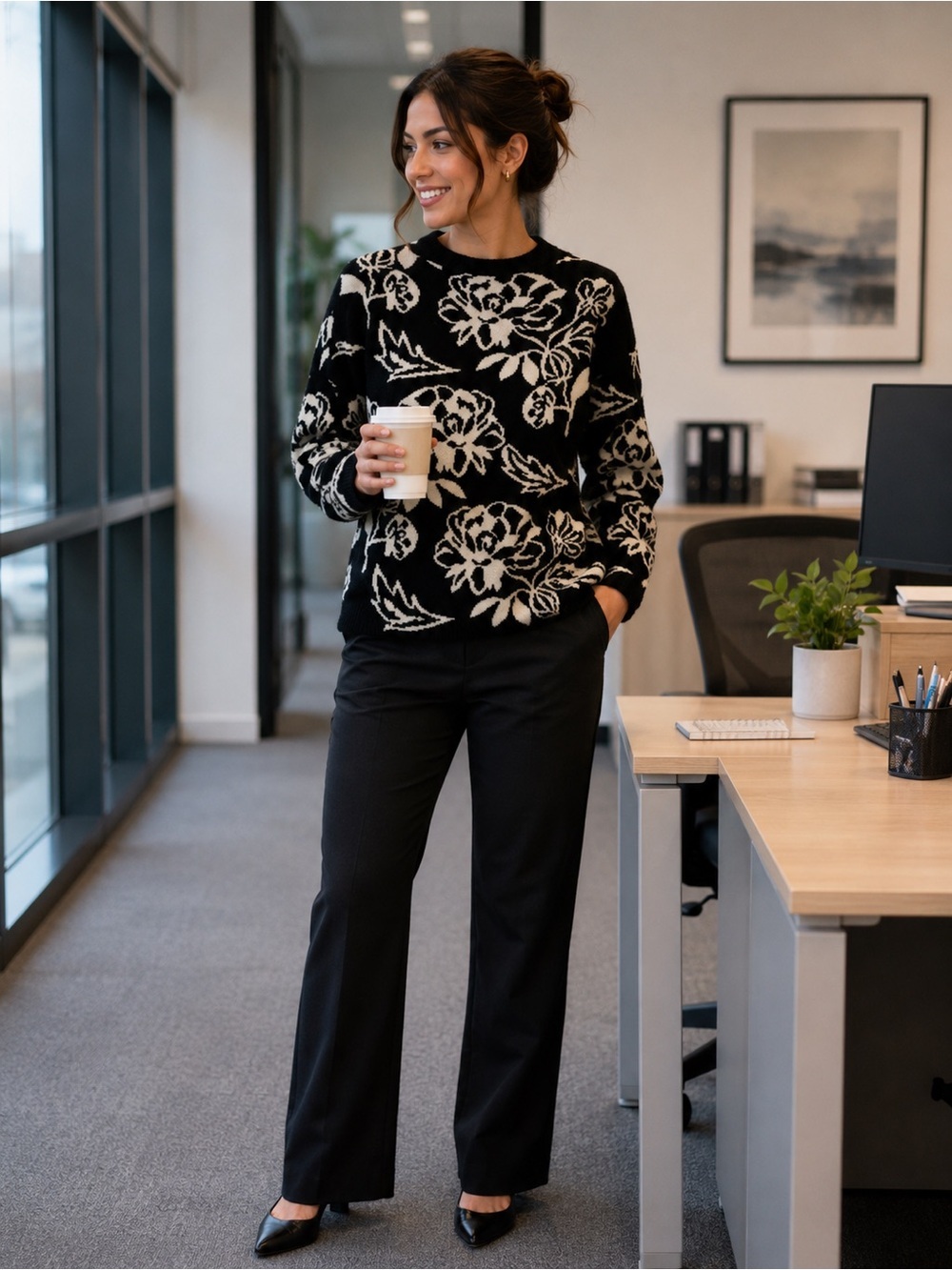 Black sweater with white flowers in women’s size small with mock turtleneck.